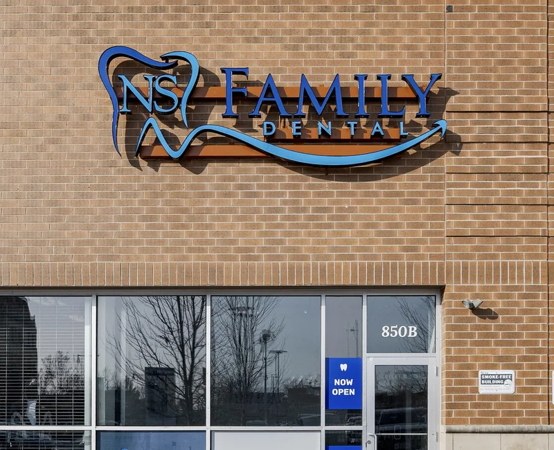 The NS Family Dental storefront at 850 W 63rd Street — brick building with the practice sign above the entrance